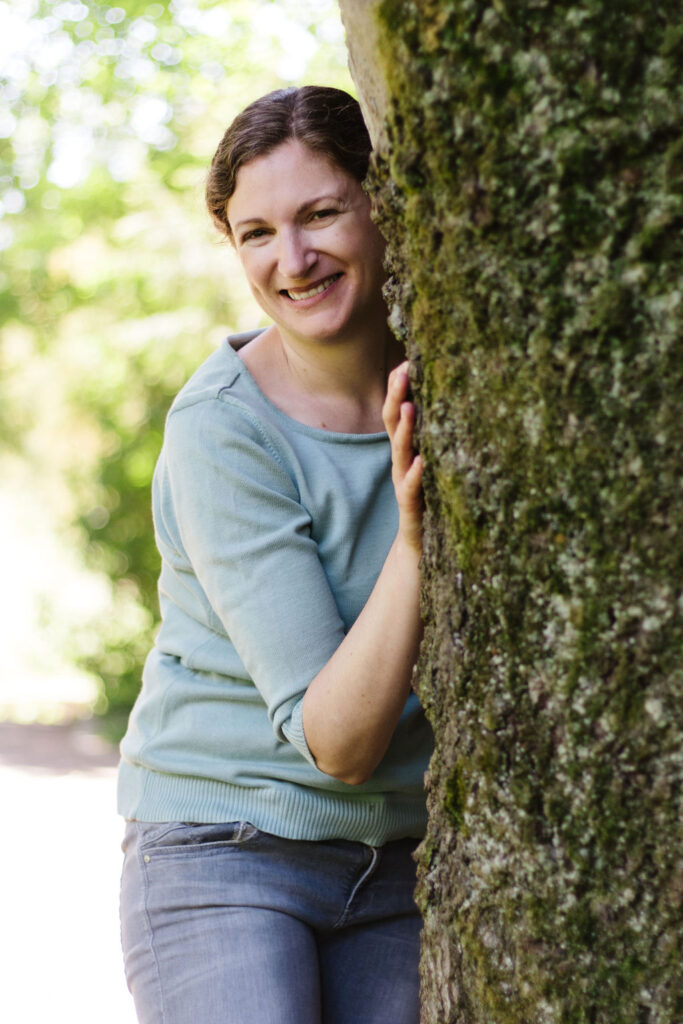 Portrait energy healer hugging a tree